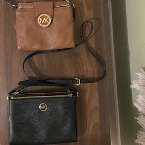 Brown and black Micheal Kors Small crossbodys both have lots of compartments.